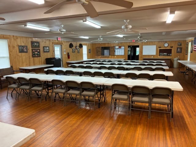 Clubhouse hall set with long tables and chairs for banquets and events