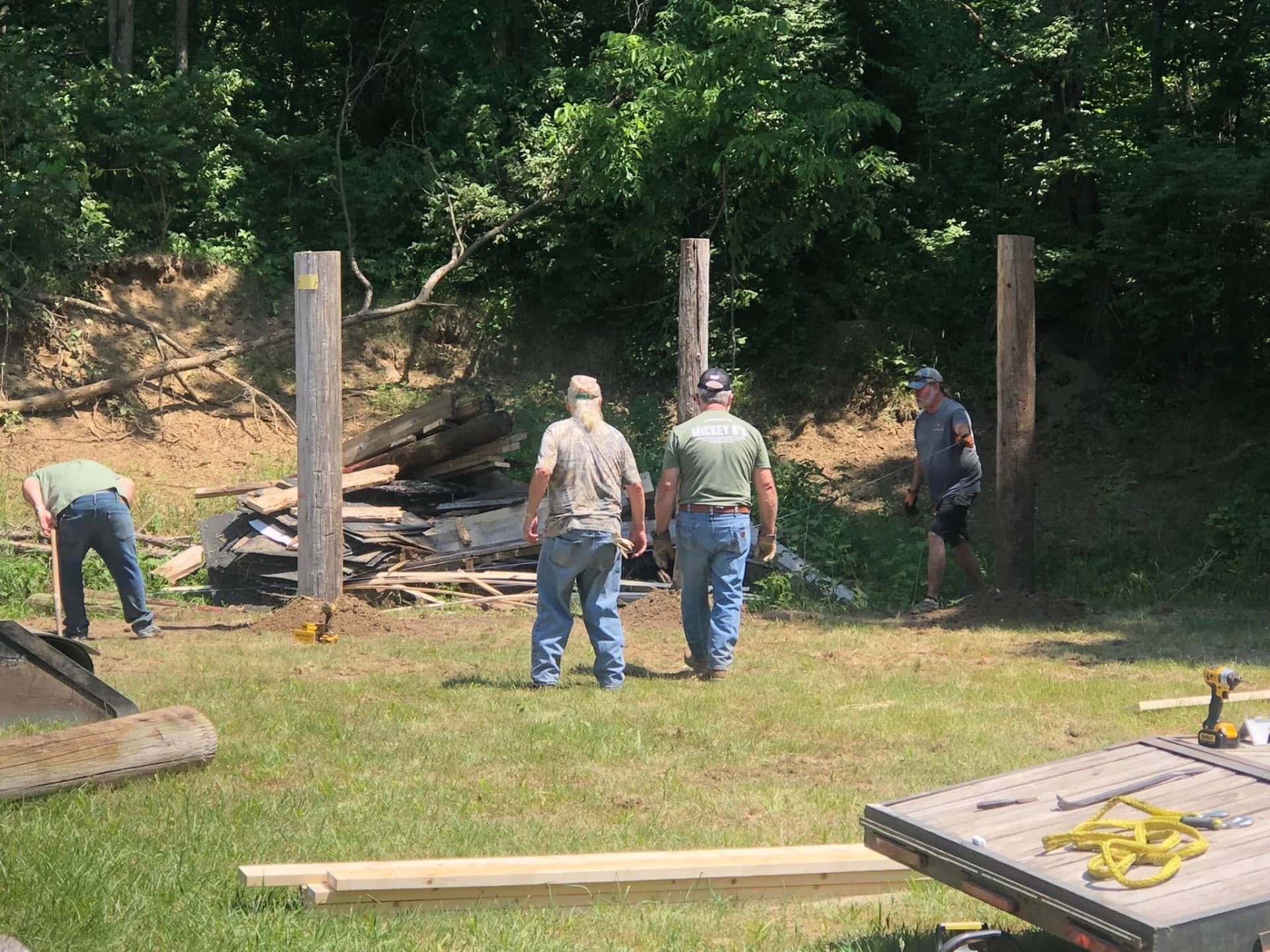 Club members setting posts while rebuilding a shooting station